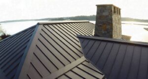 Colonial Contracting team installing new shingles on a residential roof.